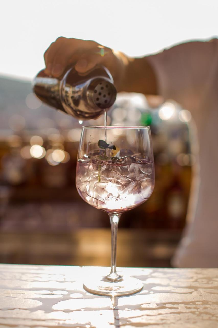 Cornaro Hotel Split Exterior photo A wine glass being filled with soda water